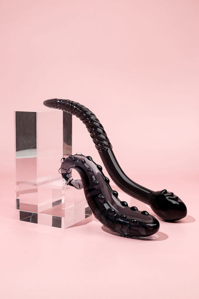 Midnight Black Ink colour Sacred squirter and Cervix Serpent glass pleasure wants both pictured on pink background and acrylic blocks.