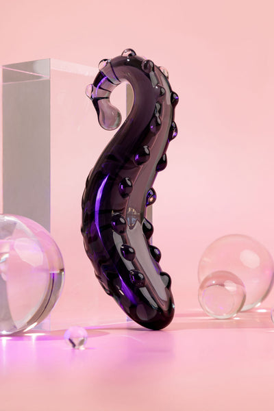 Midnight Black Ink coloured Sacred Squirter. Glass Pleasure wand with ridges pictured with acrylic block and bubbles.